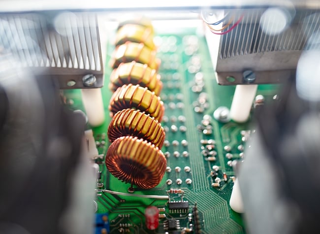 Close up of a small printed circuit board in manufacturing.