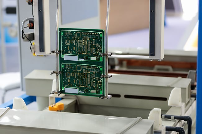 Printed circuit boards being manufactured in a state of the art turnkey electronic contract manufacturing shop.
