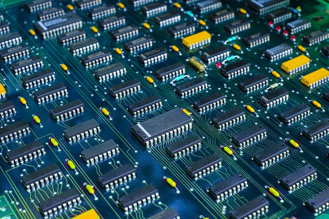 Close up of a green complex pcb in manufacturing.