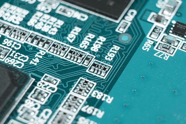 Macro shot of Circuit board with resistors microchips and electronic components. 