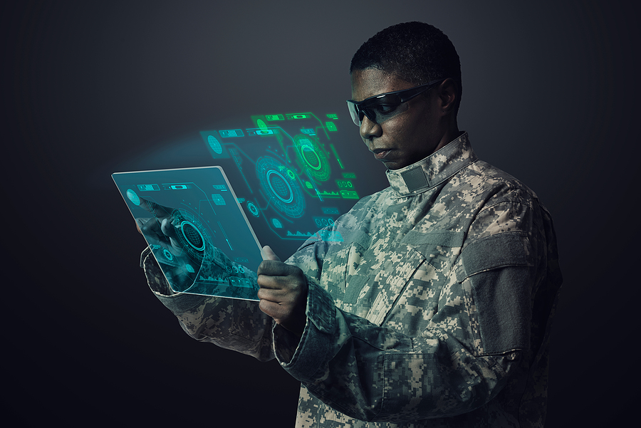 Military personnel on a high tech tablet.