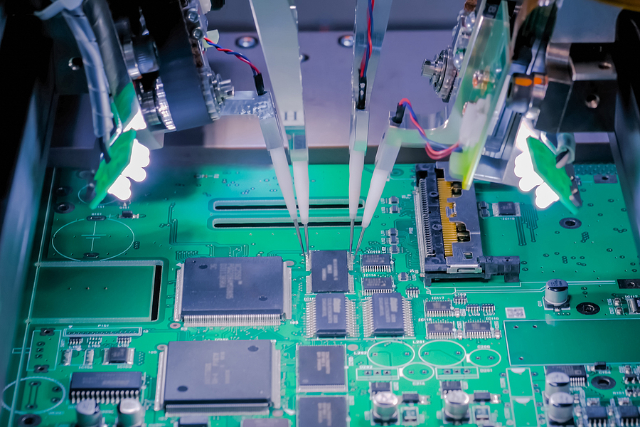 automated pcb printing. close up of a printed circuit board inside a pcb manufacturing facility owned by an electronic contract manufacturer